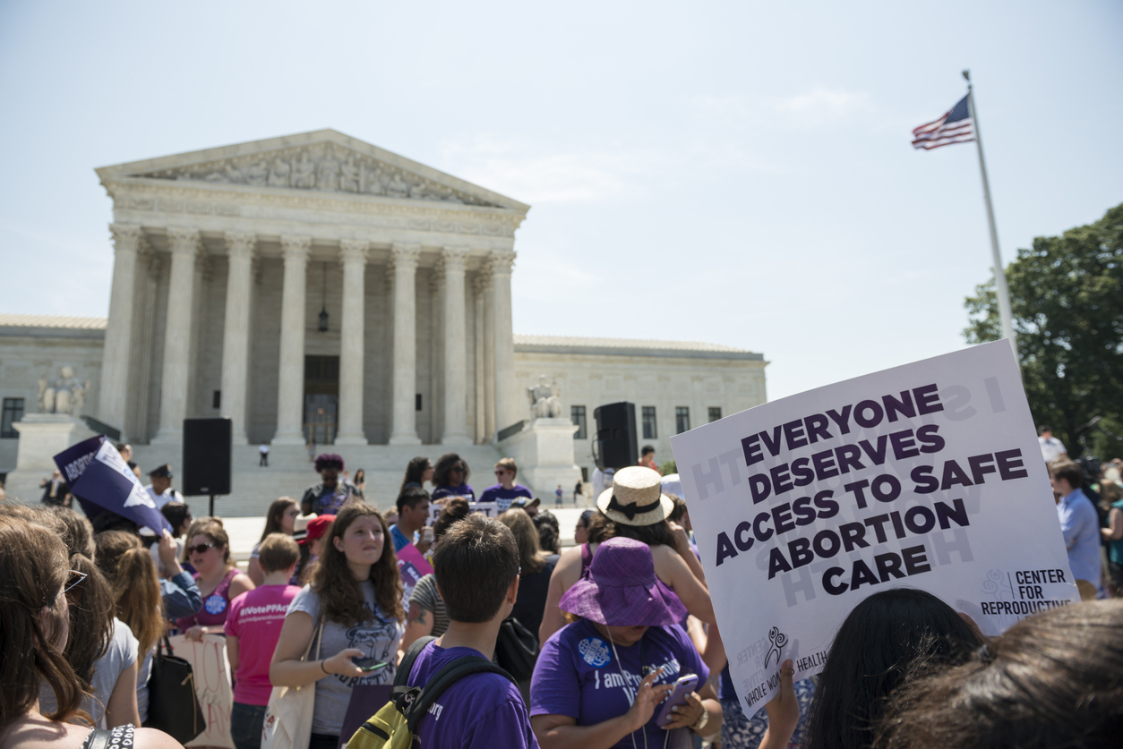 pro-choice abortion protestors protest Roe v. Wade, corporations engage employees with reproductive health benefits