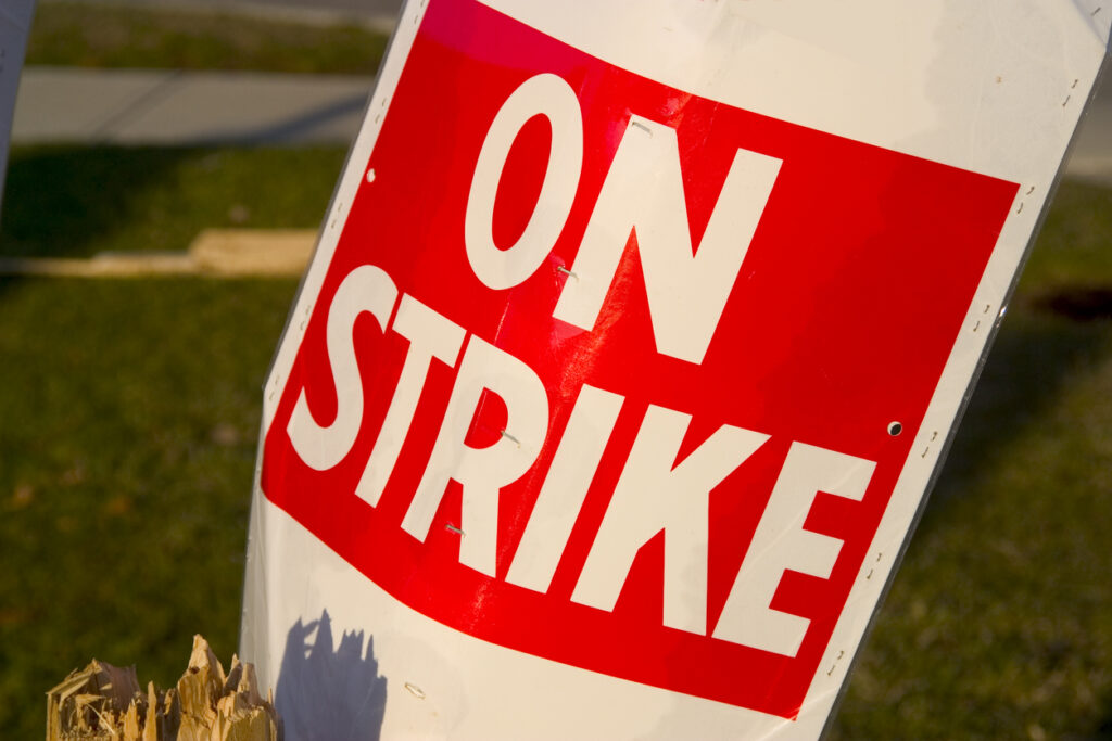 Unions ask federal regulators to protect worker mental health, auto manufacturers lay off employees amid strike